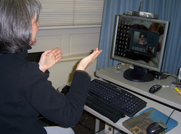 Woman having a conversation using a videophone.