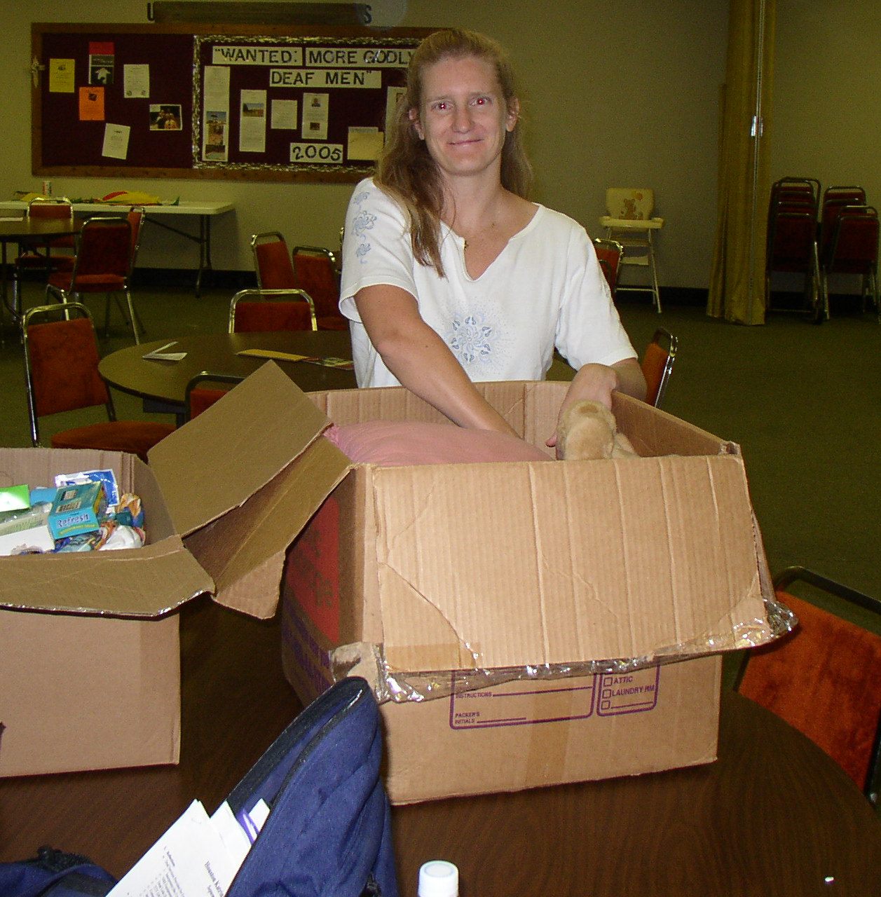 Photo of Alexis Greeves loading boxes of supplies.