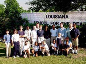 Photo of staff and students in front of Louisiana School for the Deaf.