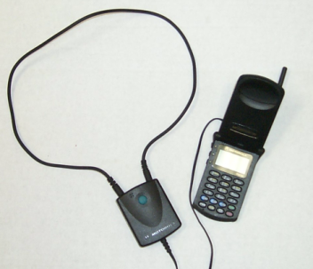 Motorola neckloop connected to a Motorola flip phone.