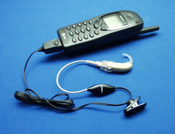 A Nokia digital cell phone hands-free (ear-bud) kit.