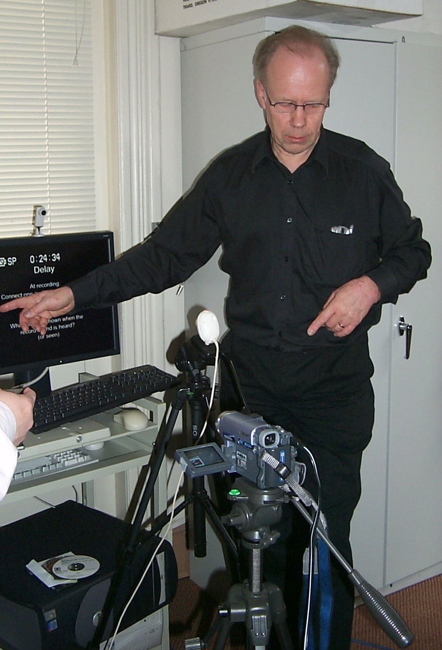 Photo of Gunnar Hellstrom setting up computer equipment and cameras.