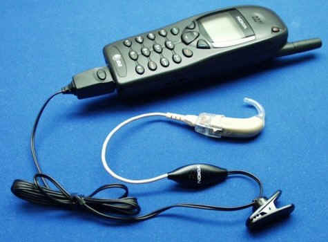 A Nokia digital cell phone hands-free (ear bud) kit modified for direct audio input (DAI), to an Oticon hearing aid. 