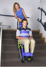 Image of woman assisting man on the stairs using an evacu-trac.