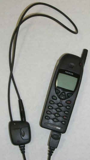 Nokia neckloop attached to a Nokia cell phone through a proprietary connector. Connector is located at the base of the handset. 